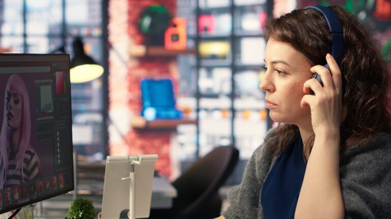 Woman expert developer works with photo editing software