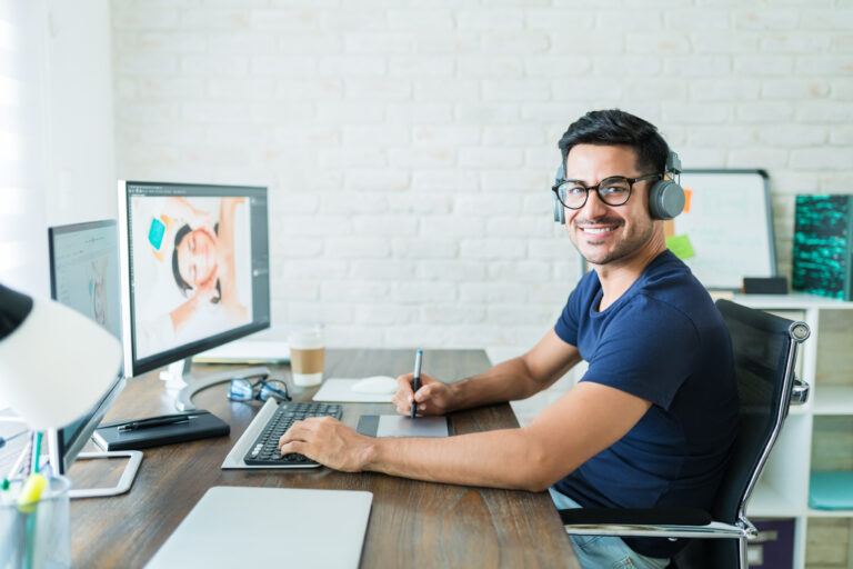 Male Freelancer Using Graphic Tablet At Home